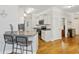 Charming kitchen featuring granite countertops, stainless steel appliances, and hardwood floors at 172 Ella Kinley Circle # 101, Myrtle Beach, SC 29588