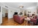 Comfortable living room with hardwood floors, ceiling fan, and open to the kitchen and dining areas at 172 Ella Kinley Circle # 101, Myrtle Beach, SC 29588