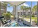 Inviting screened patio area with comfortable seating and lush green landscaping at 172 Ella Kinley Circle # 101, Myrtle Beach, SC 29588