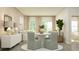 Elegant dining area adjacent to the living area, bathed in natural light and neutral decor at 1795 Hunting Harris Ct # 26, Ocean Isle Beach, NC 28469