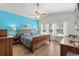 Bright bedroom offers a decorative accent wall, wood furniture, and natural light at 1833 Lake Egret Dr., North Myrtle Beach, SC 29582