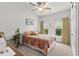 Bedroom with quilt bed cover, ceiling fan, and windows at 1833 Lake Egret Dr., North Myrtle Beach, SC 29582