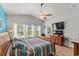 Bright bedroom featuring a vaulted ceiling, wood floors, large windows, and a flat screen television at 1833 Lake Egret Dr., North Myrtle Beach, SC 29582