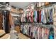 Walk-in closet featuring ample storage for clothes, shoes, and accessories with wood-look floors at 1833 Lake Egret Dr., North Myrtle Beach, SC 29582