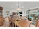 Well lit dining room includes a large table, chairs, and natural light at 1833 Lake Egret Dr., North Myrtle Beach, SC 29582