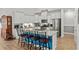 Kitchen island features modern white cabinetry and granite counters with seating and blue accents at 1833 Lake Egret Dr., North Myrtle Beach, SC 29582