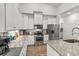 Bright kitchen with granite counters, stainless appliances, and a convenient breakfast bar at 1833 Lake Egret Dr., North Myrtle Beach, SC 29582
