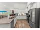 The kitchen offers stainless steel appliances, granite counters, and stylish white cabinetry at 1833 Lake Egret Dr., North Myrtle Beach, SC 29582