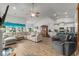 Bright living room features vaulted ceiling, wood floors, and a large comfortable sectional sofa at 1833 Lake Egret Dr., North Myrtle Beach, SC 29582