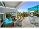 Inviting covered patio featuring a fire pit, grill, and comfortable seating, perfect for outdoor entertaining at 1833 Lake Egret Dr., North Myrtle Beach, SC 29582
