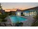 Relaxing pool with a brick patio, perfect for outdoor entertaining and enjoying the serene backyard setting at 1833 Lake Egret Dr., North Myrtle Beach, SC 29582