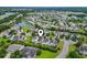 An aerial view pinpoints the home in a neighborhood near a lake and green spaces at 185 Fulbourn Pl., Myrtle Beach, SC 29579