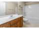 Clean bathroom with a white vanity, matching toilet, and shower-tub combo, offering a practical and functional space at 185 Fulbourn Pl., Myrtle Beach, SC 29579