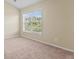 Comfortable bedroom with natural light and neutral carpeting, creating a serene space for relaxation and rest at 185 Fulbourn Pl., Myrtle Beach, SC 29579