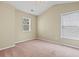 Inviting bedroom bathed in natural light, features plush carpeting and a serene ambiance, perfect for rest and relaxation at 185 Fulbourn Pl., Myrtle Beach, SC 29579