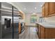 Spacious kitchen boasts stainless steel appliances, ample cabinet space, and modern wood flooring at 185 Fulbourn Pl., Myrtle Beach, SC 29579
