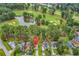 Desirable home features a well-manicured lawn and serene views of the adjacent golf course and pond at 1880 Plantation Dr., Myrtle Beach, SC 29577