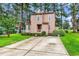 Charming two-story home with front yard, tidy landscaping, and long private driveway at 1880 Plantation Dr., Myrtle Beach, SC 29577