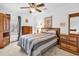Comfortable bedroom featuring a ceiling fan, neutral color scheme, and lots of light at 1880 Plantation Dr., Myrtle Beach, SC 29577
