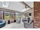 Comfortable sunroom with lots of natural light and views of a well manicured lawn at 1880 Plantation Dr., Myrtle Beach, SC 29577
