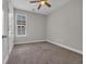 Bedroom featuring window with blinds and neutral colored walls and carpet at 2080 Silver Island Way, Murrells Inlet, SC 29576