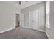 Bedroom with neutral carpet and walls, double door closet and attached bathroom view at 2080 Silver Island Way, Murrells Inlet, SC 29576