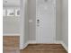Foyer with wood-look floors, a white front door, and neutral wall color at 2080 Silver Island Way, Murrells Inlet, SC 29576