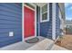 Stylish red front door with blue siding, window and modern security features at 2080 Silver Island Way, Murrells Inlet, SC 29576