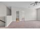 Cozy loft area with carpeted flooring, access to a bathroom, and ample natural light at 2080 Silver Island Way, Murrells Inlet, SC 29576