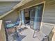 Relaxing balcony with comfortable seating and sliding glass doors leading to a bright and airy interior at 210 Westleton Dr. # 13-D, Myrtle Beach, SC 29572