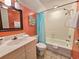 Bathroom featuring white vanity with sink, a framed mirror, and tiled shower at 210 Westleton Dr. # 13-D, Myrtle Beach, SC 29572