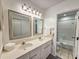 Bright bathroom featuring double sinks, vanity, and a shower/tub combo at 210 Westleton Dr. # 13-D, Myrtle Beach, SC 29572