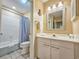 Bathroom with white cabinetry, sink, a large mirror and a shower and bathtub combo at 210 Westleton Dr. # 13-D, Myrtle Beach, SC 29572