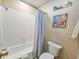 Cozy bathroom with a shower and bath combo and a 'Beach' decoration above the toilet at 210 Westleton Dr. # 13-D, Myrtle Beach, SC 29572