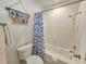 Bathroom showcasing a tub with a shower, toilet, and beach decor at 210 Westleton Dr. # 13-D, Myrtle Beach, SC 29572