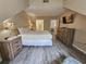 Comfortable bedroom with a dresser, TV, and view into the bathroom at 210 Westleton Dr. # 13-D, Myrtle Beach, SC 29572