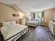 Bedroom featuring two beds, a chest of drawers, and a window at 210 Westleton Dr. # 13-D, Myrtle Beach, SC 29572