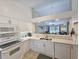 Open-concept kitchen features white cabinetry, modern appliances, and a view into the living area at 210 Westleton Dr. # 13-D, Myrtle Beach, SC 29572