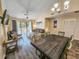 Open concept living area with balcony access, dining area, fireplace, and modern furnishings at 210 Westleton Dr. # 13-D, Myrtle Beach, SC 29572