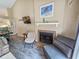 Comfortable living room featuring a fireplace, stylish furnishings, and a partial view of the adjacent dining area at 210 Westleton Dr. # 13-D, Myrtle Beach, SC 29572