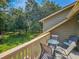 Comfortable outdoor seating on a private balcony offering scenic views of the surrounding green landscape at 210 Westleton Dr. # 13-D, Myrtle Beach, SC 29572