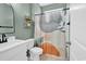 Stylish bathroom featuring white vanity, decorative shower curtain, and wood-look tile flooring at 218 Calhoun Falls Dr., Myrtle Beach, SC 29579