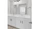 Bright bathroom showcasing a double sink vanity with granite countertop and decorative mirrors at 218 Calhoun Falls Dr., Myrtle Beach, SC 29579