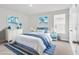 Comfortable bedroom featuring blue and white decor, with bed, rug, and nautical artwork at 218 Calhoun Falls Dr., Myrtle Beach, SC 29579