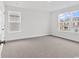Bright, carpeted bedroom with neutral walls and large windows offering plenty of natural light at 218 Calhoun Falls Dr., Myrtle Beach, SC 29579