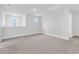 Spacious room with neutral carpeting, two windows, and neutral walls at 218 Calhoun Falls Dr., Myrtle Beach, SC 29579