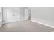 Neutral bedroom showing neutral carpeting, baseboard trim, and double closet doors at 218 Calhoun Falls Dr., Myrtle Beach, SC 29579