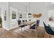 Bright dining area featuring modern decor, large windows, and hardwood floors at 218 Calhoun Falls Dr., Myrtle Beach, SC 29579