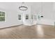 Airy living space filled with lots of natural light and windows, paired with gorgeous hardwood floors at 218 Calhoun Falls Dr., Myrtle Beach, SC 29579