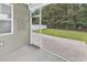 View from the screened-in porch, featuring a concrete floor and a door to the backyard at 218 Calhoun Falls Dr., Myrtle Beach, SC 29579